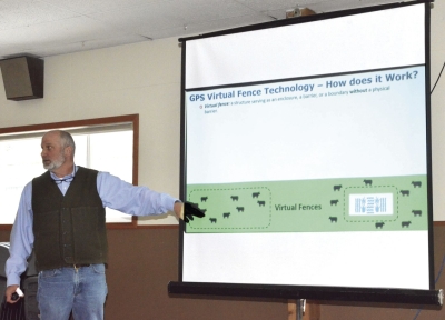 David Bohnert of OSU explains to listeners at the Cloverleaf Hall in Enterprise how virtual fencing can keep livestock in or out of a designated area.